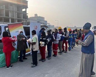 District 2452 - Bahrain: Rotary Club of Salmaniya Distribute Food and Winter clothes to Construction Labourers